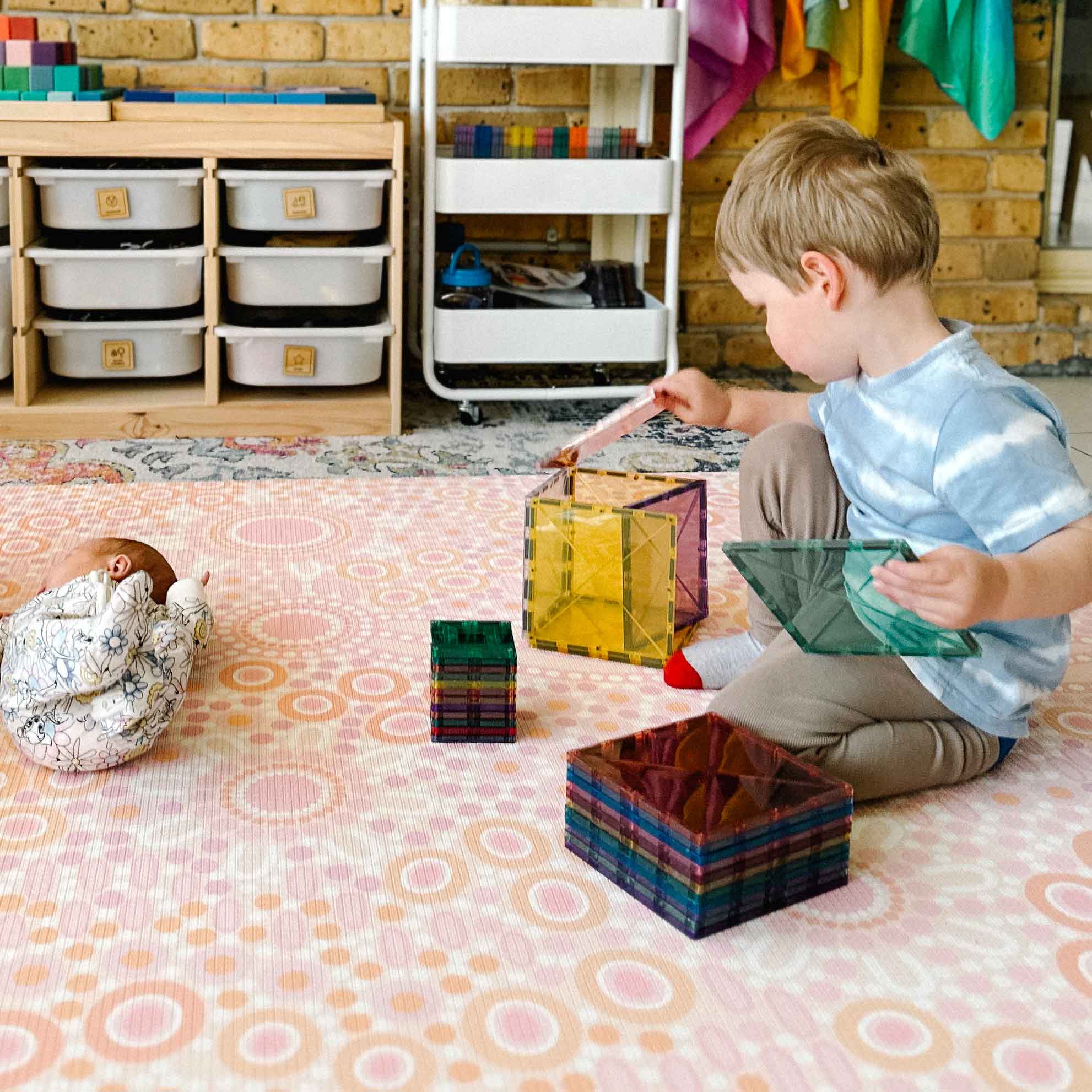 magnetic tiles on a play mat